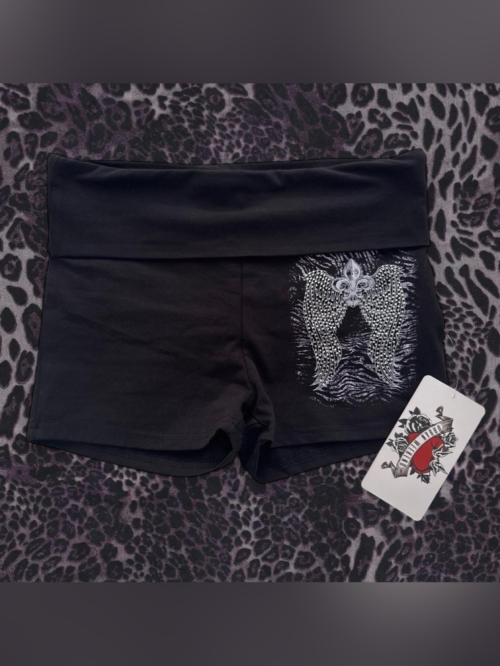 Urban Weekend black shorts with silver rhinestone angel wings and fleur delis